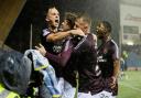 Alex Lowry's last-gasp winner sent Hearts through to the semi-finals of the League Cup