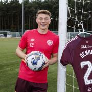 Hearts midfielder Aidan Denholm has been called into the Scotland Under-21 squad